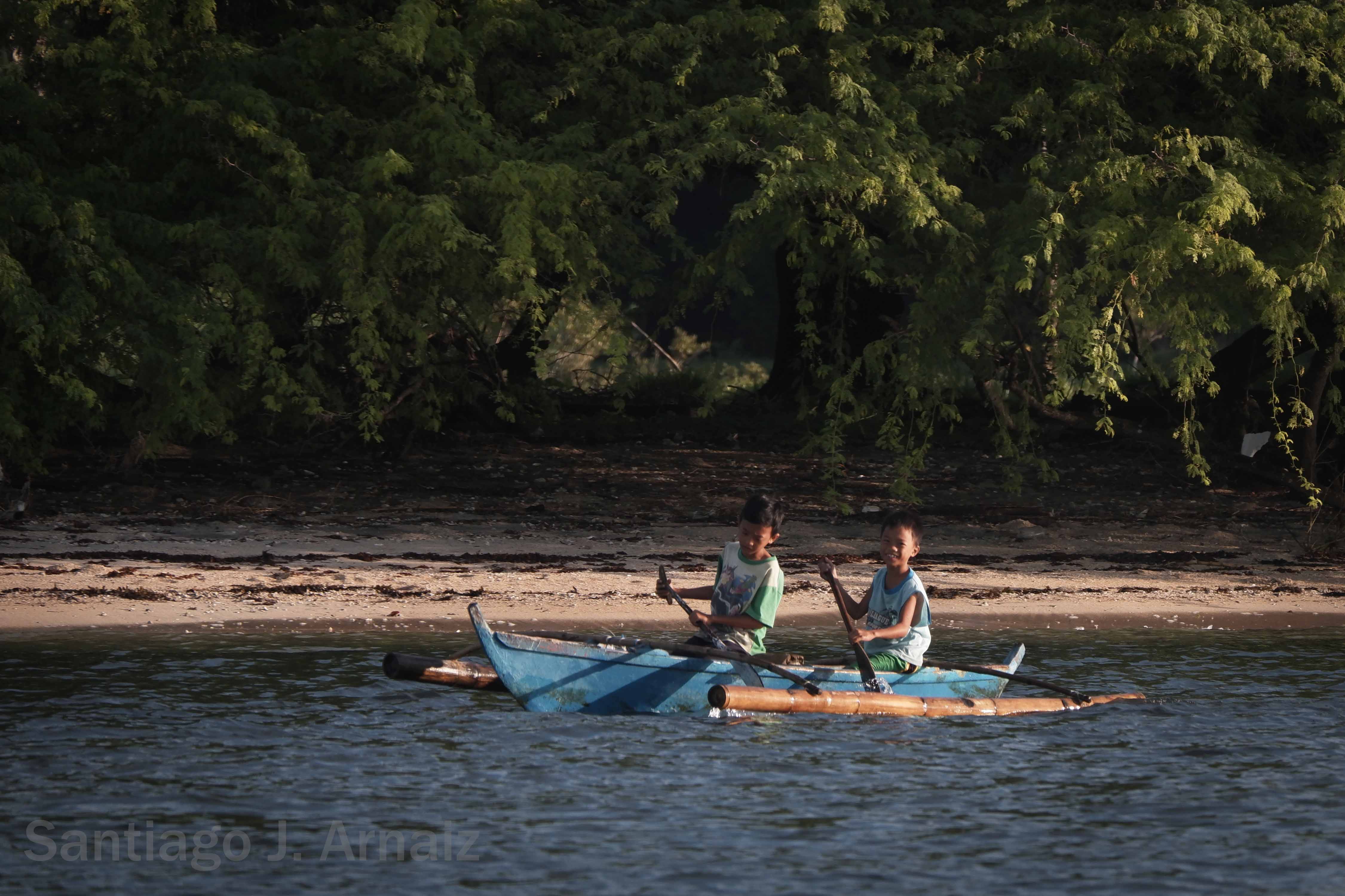 Masinloc residents by the beach